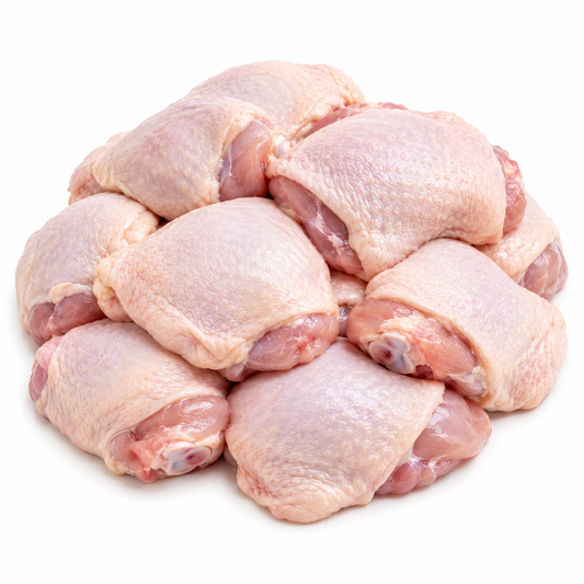 Pile of raw chicken thighs on a white background